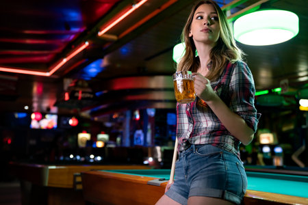 Portrait of beautiful young woman in billiard club