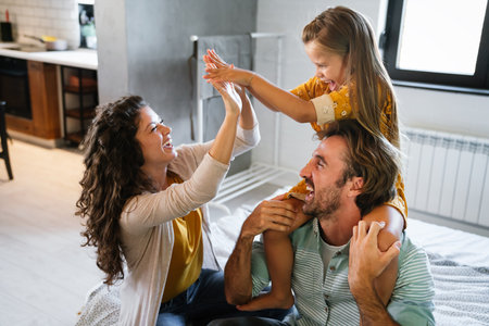 Happy family having fun time at home. Parents child love concept.の写真素材
