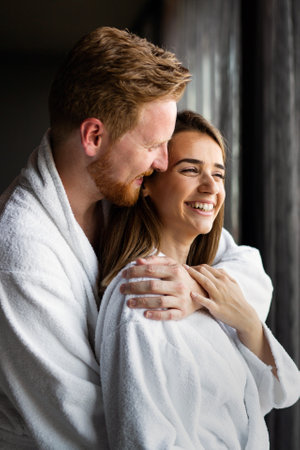 Beautiful young couple enjoying and relaxing in SPA center. People enjoying weekend, holidayの写真素材