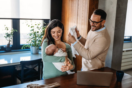 Family, adoption, baby, parenthood and people concept. Happy mother father with newborn baby at home