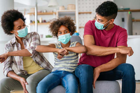 Family is wearing facemasks during coronavirus and flu outbreak. Virus and illness protection, COVIDの写真素材