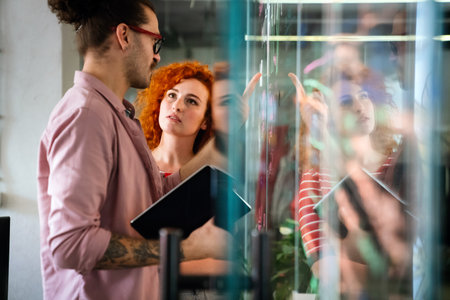 Software, coding and business woman on tablet thinking of data analytics, digital technology.