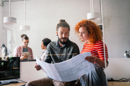 Young business people, engineers, managers working with new startup project in modern officeの写真素材