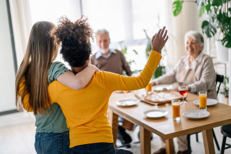 Multiethnic, three generation family together celebration with parents grandparents and childrenの写真素材