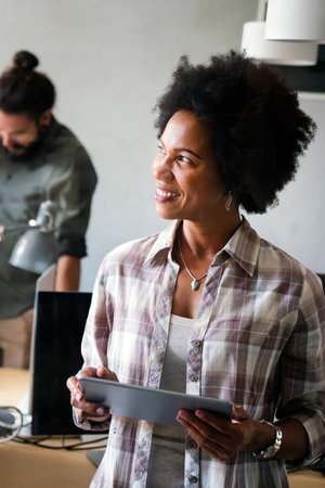 Success black woman with tablet, analytics and developer for startup business website IT softwareの写真素材
