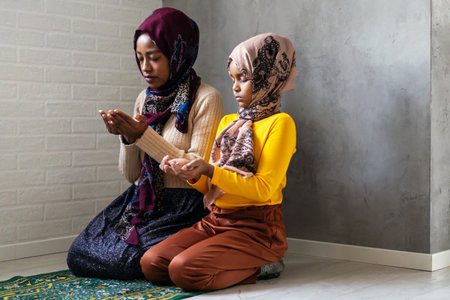 Praying and teaching, child and adult praying together
