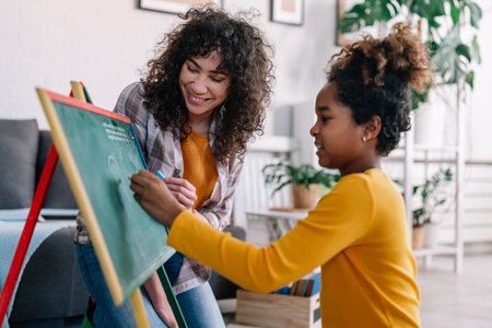 Multiethnic black diverse family teaching child. Home education family conceptの写真素材