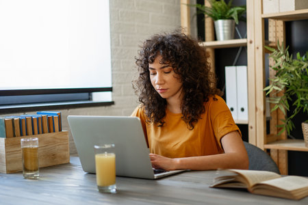 Young student girl working, learning in college libraryの写真素材