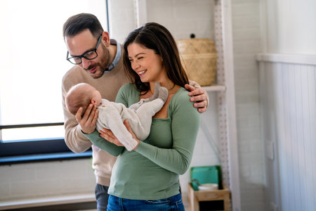 Family love parenthood baby concept. Parents spend happy moments with the newborn childの写真素材