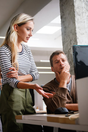 Programmers working in a software developing company officeの写真素材