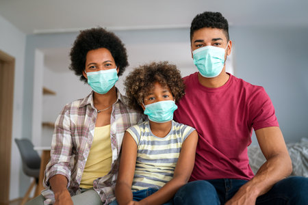 Family is wearing facemasks during coronavirus and flu outbreak. Virus and illness protection, COVIDの写真素材