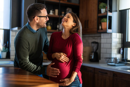 Man in love hugs his pregnant wife, they are waiting together for the babys arrival. Love, familyの写真素材