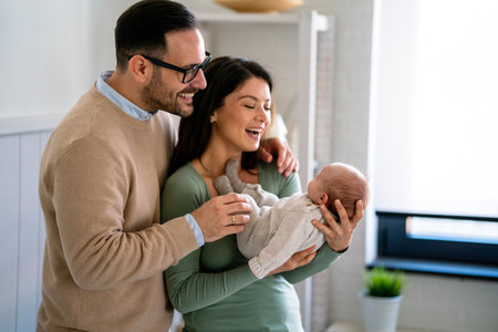 Family love parenthood baby concept. Parents spend happy moments with the newborn childの写真素材