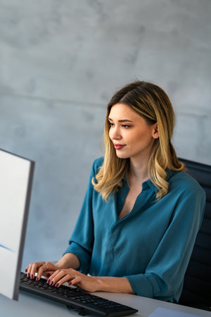 Happy professional business woman company employee, young entrepreneur smiling businesswoman workingの写真素材