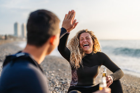 Happy young people, friends enjoying summer vacation with drink and surf at the beach