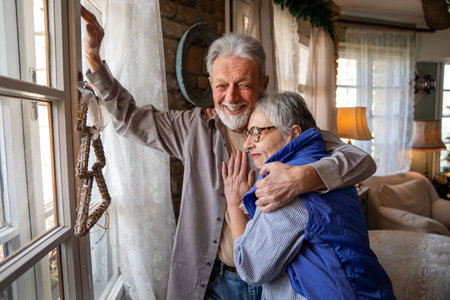 Elderly couple in love. Senior husband and wife hugging and bonding with true emotionsの写真素材