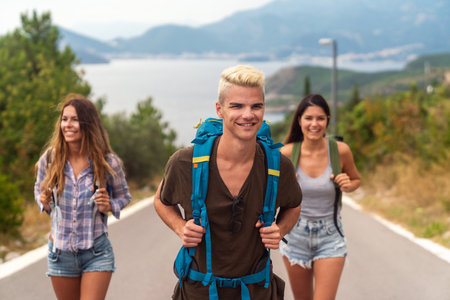 Friendship, travel, vacation, summer and people concept. Group of smiling friends with map travelingの写真素材