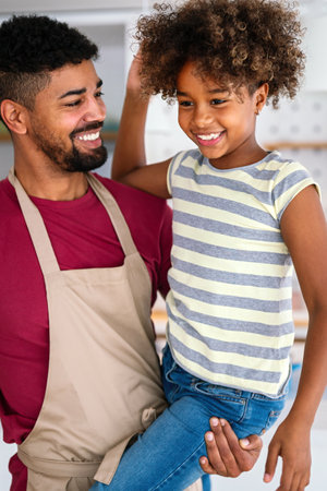 Happy african american single dad spends happy moments with his daughter. Family love conceptの写真素材