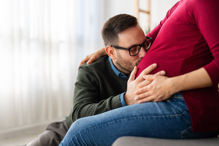 Man in love hugs his pregnant wife, they are waiting together for the babys arrival. Love, familyの写真素材