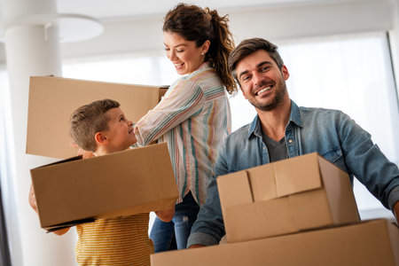 New home, box and parents with child in new house, property mortgage and real estate investment.の写真素材