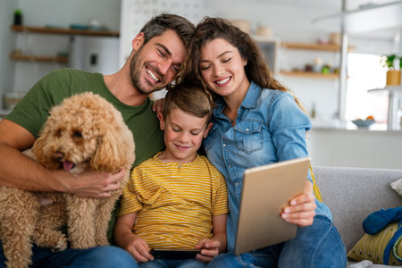 Happy family, parents with cute excited small kids son using laptop computer at home. Technologyの写真素材