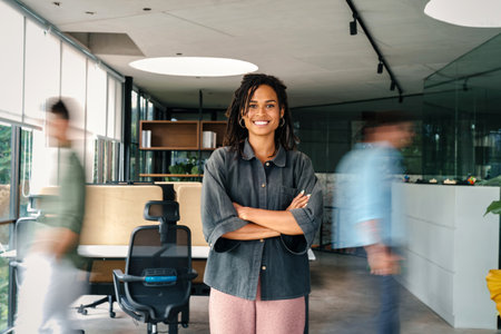 Confidence and happy smiling business woman portrait with blur motion background of his colleagueの写真素材