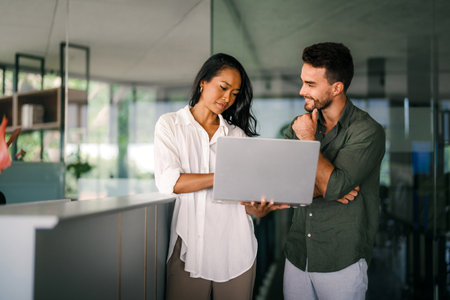 Diverse startup, business people working together on laptop computer in modern officeの写真素材