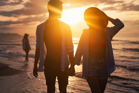 Vacation couple walking on beach together in love. Travel honeymoon people happiness conceptの写真素材