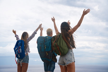 Group of backpacker friends with backpack traveling and enjoying the healthy lifestyle togetherの写真素材