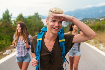 Friendship, travel, vacation, summer and people concept. Group of smiling friends with map travelingの写真素材