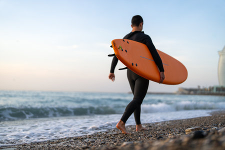 Summer adventure water sports concept. Happy carefree man surfing, living healthy active lifestyleの写真素材