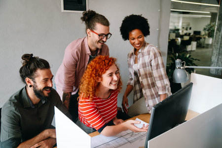 Group of business people and software developers working as a team in officeの写真素材