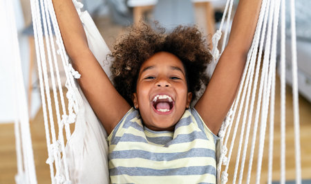 Portrait of happy cute african american preteen little girl at home. Childhood kid children conceptの写真素材