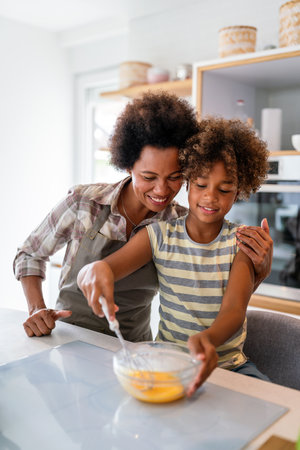 Caring african american mother hugging teenage daughter, enjoy moment of love, motherhood conceptの写真素材