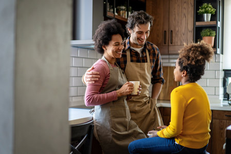 Happy multiethnic family in love together in kitchen. Parents child together conceptの写真素材