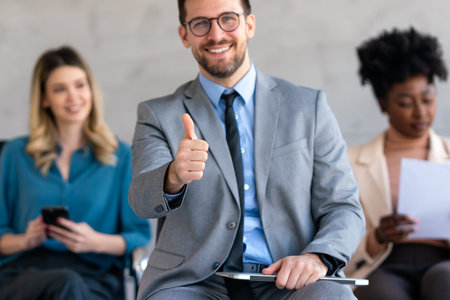 Excited overjoyed diverse business people, team celebrate corporate victory together in officeの写真素材