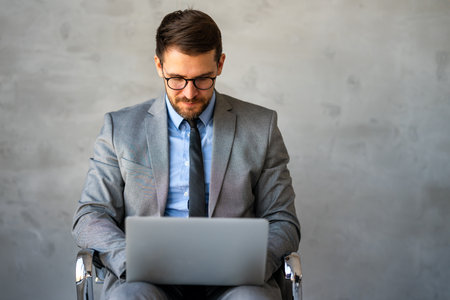 Success young professional businessman investor,manager at workplace working on computer in officeの写真素材