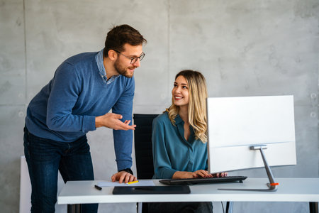Team of programmers working together in an officeの写真素材