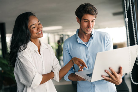 Diverse startup, business people working together on laptop computer in modern officeの写真素材