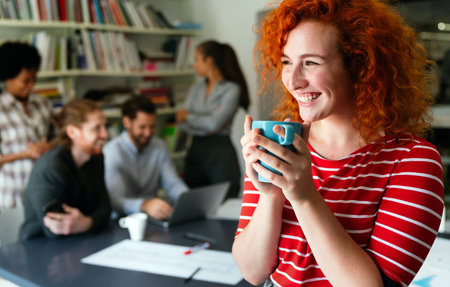 Portrait of young happy success woman working in a busy modern workplace, Startup coworker conceptの写真素材