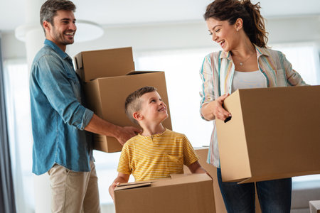 New home. Parents with child moving in new house, property mortgage and real estate investment.の写真素材