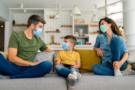 Sad family wearing protective medical mask for prevent virus, flu, pollution. Family protectionの写真素材