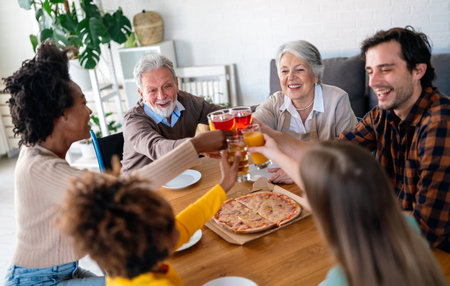 Happy multiethnic multigeneration family with husband, wife, children, grandfather and grandmotherの写真素材