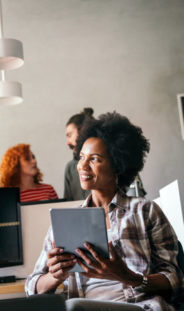 Success black woman with tablet, analytics and developer for startup business website IT softwareの写真素材