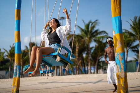 Beautiful diverse couple enjoying in good mood on the beach. Lifestyle love dating vacation conceptの写真素材