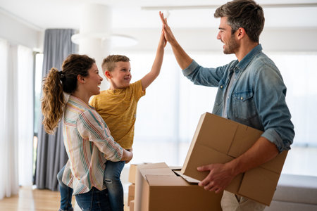 New home. Parents with child moving in new house, property mortgage and real estate investment.の写真素材