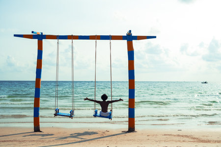Happy man enjoying water sports, sunshine, the beauty of the ocean for the perfect vacation escapeの写真素材