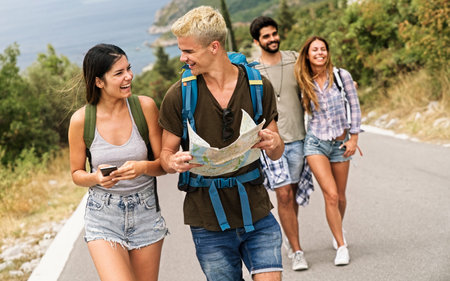 Friends, women and map in nature for adventure, road trip and travel with directions and diversity.の写真素材