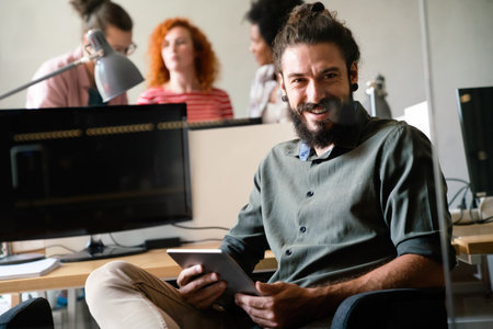 Success business man with tablet, analytics and developer for startup business website IT softwareの写真素材