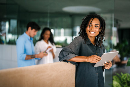 Successful happy african american business woman, startup coworker or software programmer engineerの写真素材